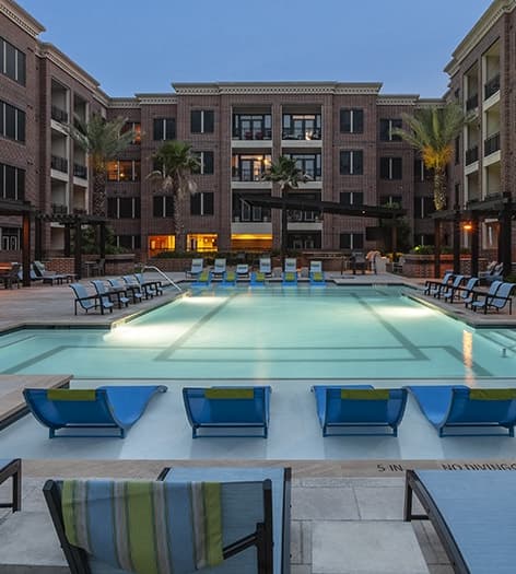 Pool view at night at Yale at 6th luxury apartment homes in Houston, TX