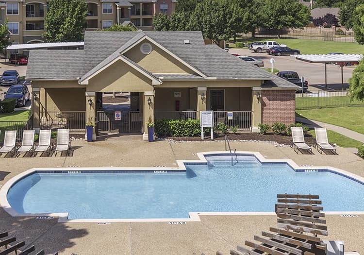 Pool area at Colonial Village at Shoal Creek luxury apartment homes in Dallas, TX