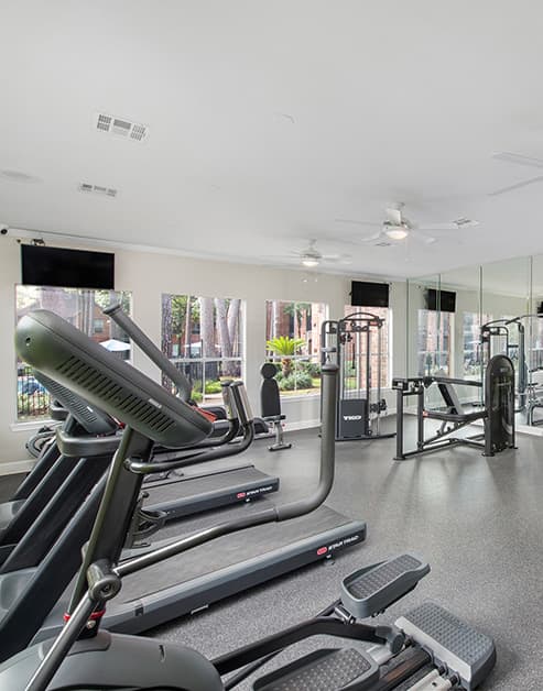 Fitness center at MAA Greenwood Forest luxury apartment homes in Houston, TX