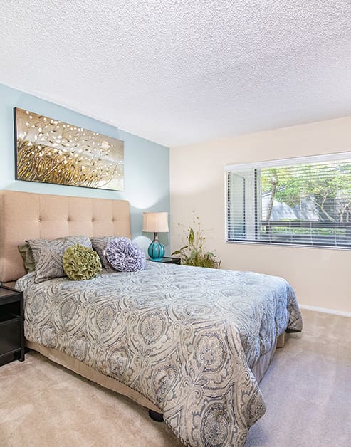 Bed at MAA Carrollwood luxury apartment homes in Tampa, FL