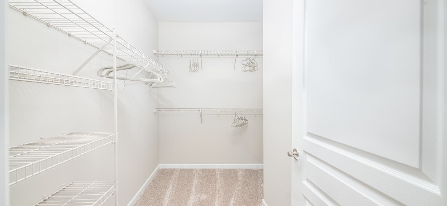 Spacious multi-shelf walk-in closet of a unit at MAA Riverside luxury apartments in Atlanta, GA