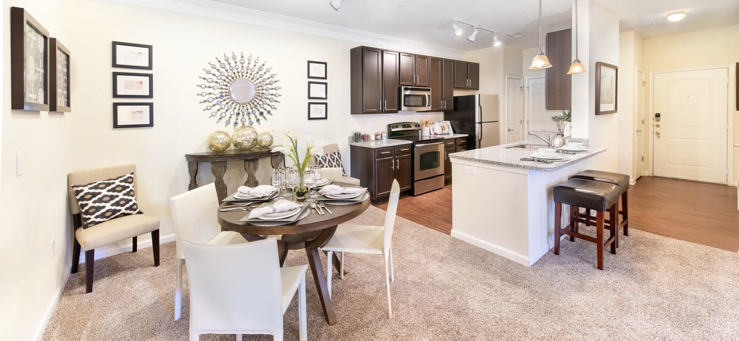 Kitchen and dining area at Seasons at Celebrate Virginia luxury apartment homes in Fredericksburg, VA