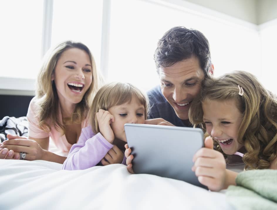 Family looking at an iPad