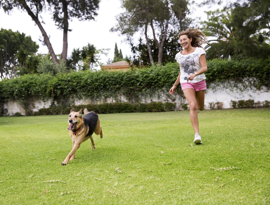 Lifestyle girl with dog in park