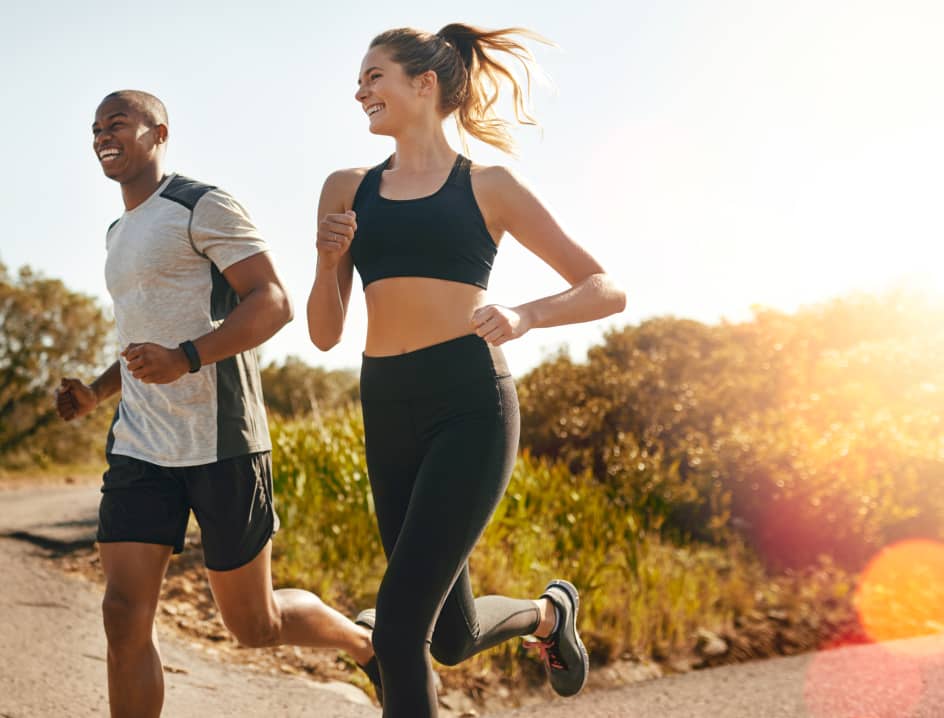 Friends jogging together outdoors