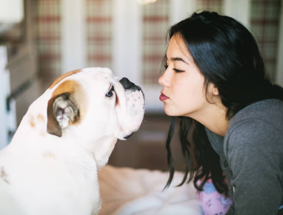 Woman and dog face to face