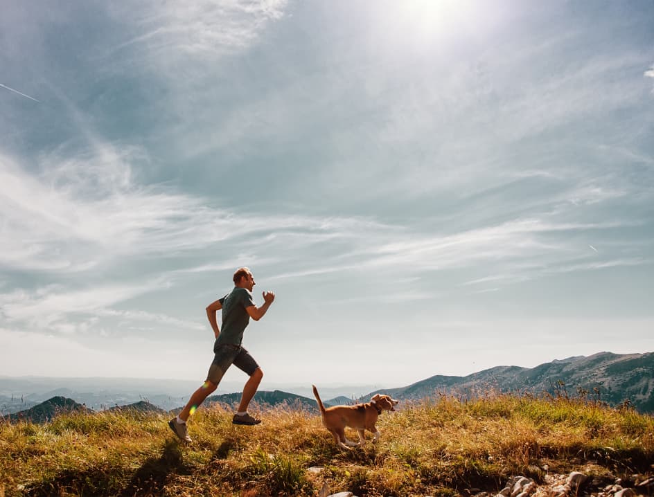 Man runs with dog