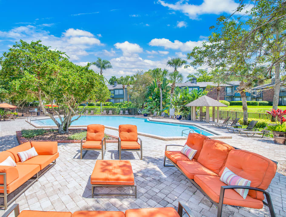 Pool deck at MAA Tiffany Oaks luxury apartment homes in Orlando , FL