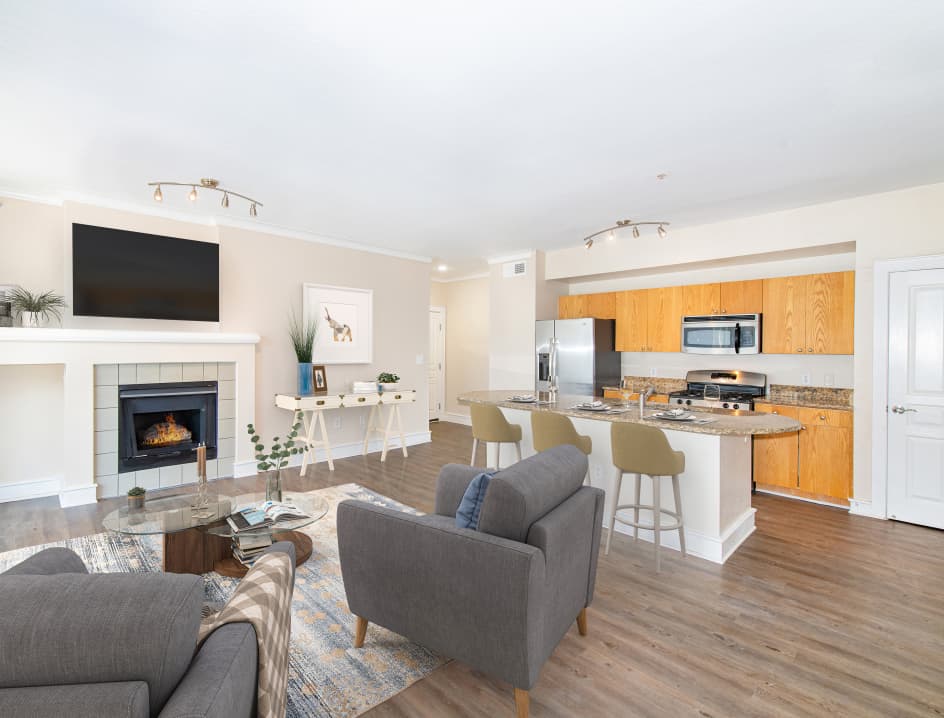 Kitchen and living area at MAA Abbey luxury apartment homes in Dallas, TX