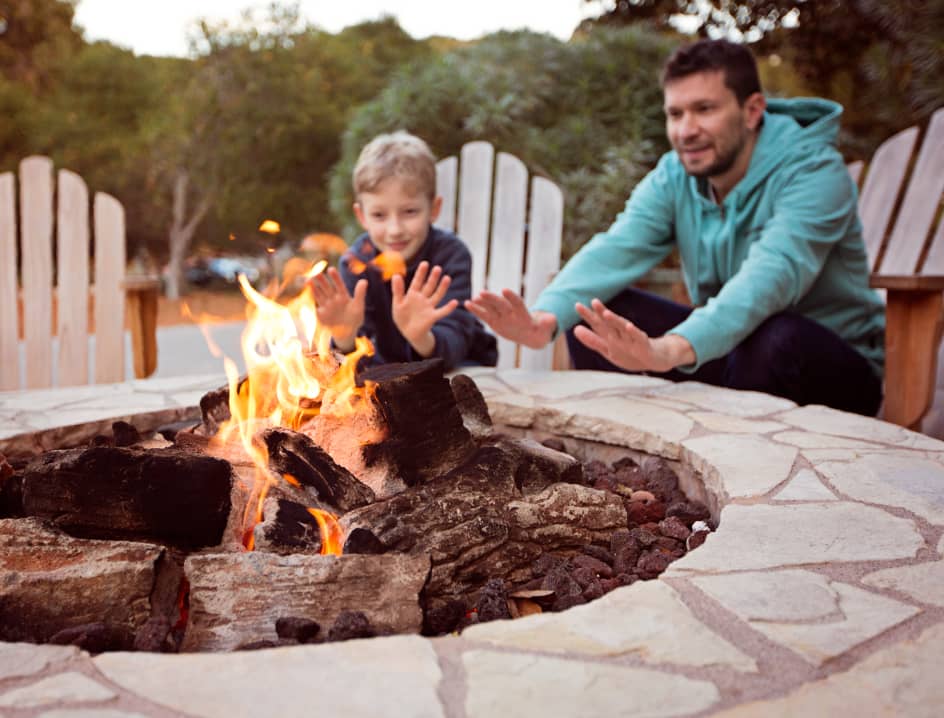 Dad and son enjoy the firepit