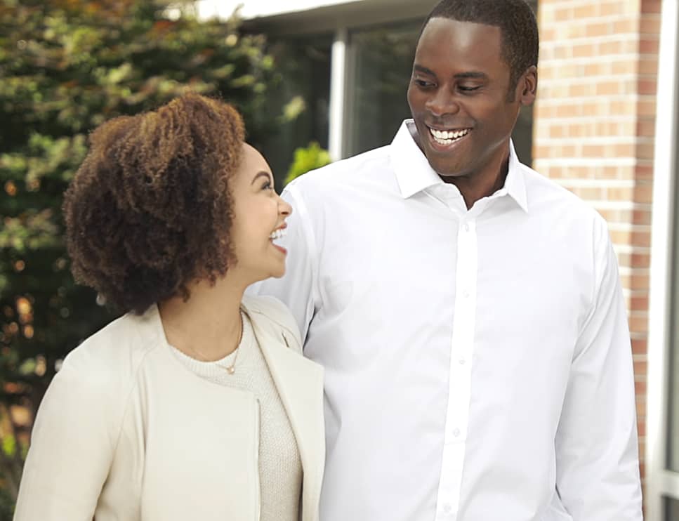 Man and Woman Smiling Outside