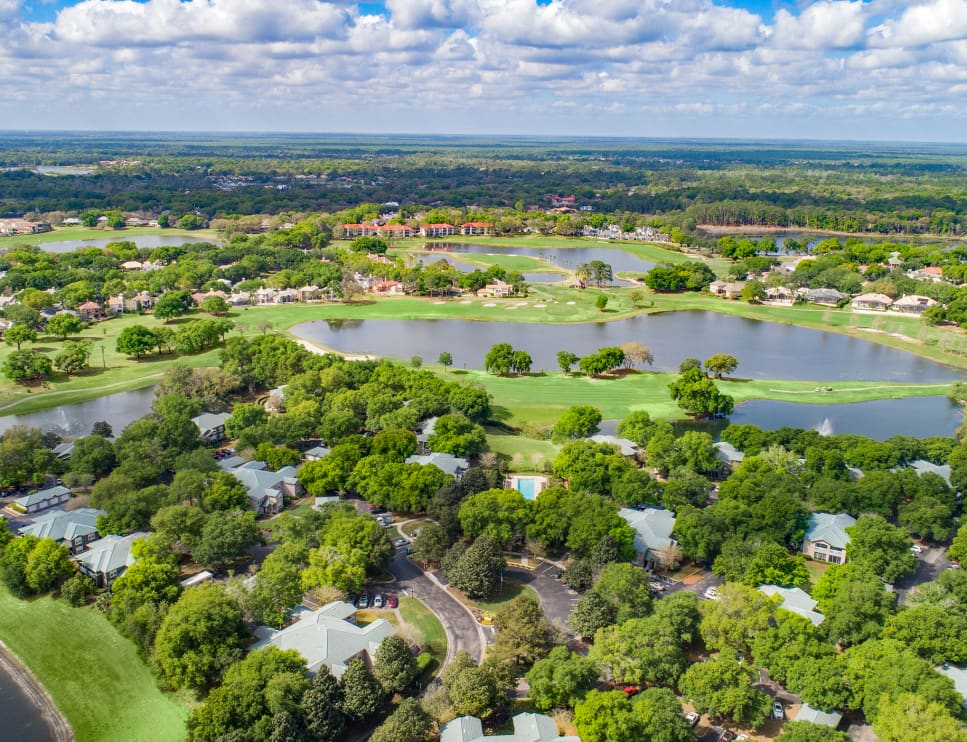Aerial view of MAA Heathrow community of luxury apartments nestled between lush green landscape in Heathrow, FL