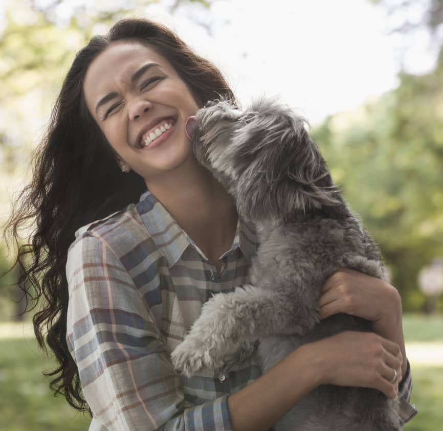 Woman holding dog