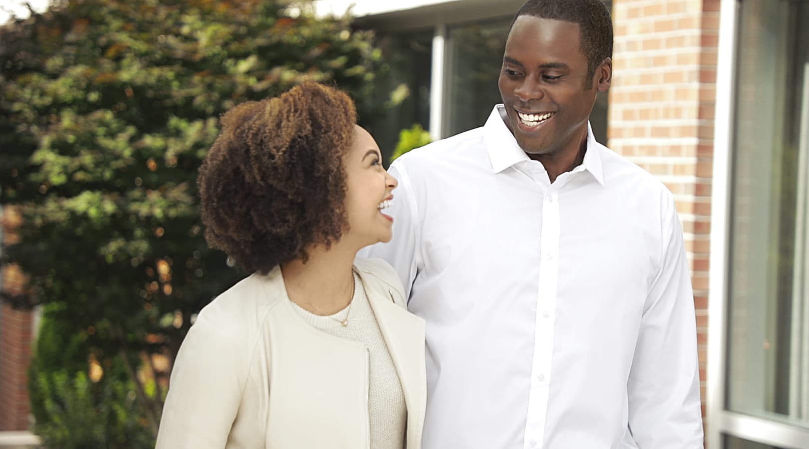 Man and Woman Smiling Outside