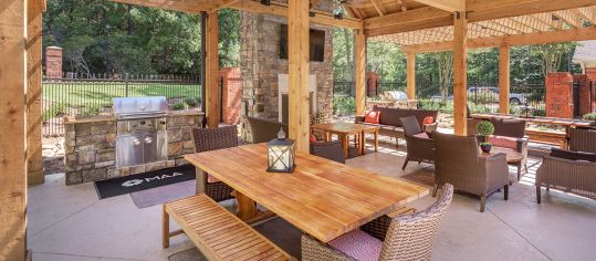 Outdoor Grills and Dining Area at Colonial Grand at Riverchase Trails luxury apartment homes in Birmingham, AL