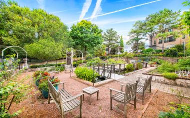 Lush community garden with a walking path at MAA Riverside luxury apartments in Atlanta, GA