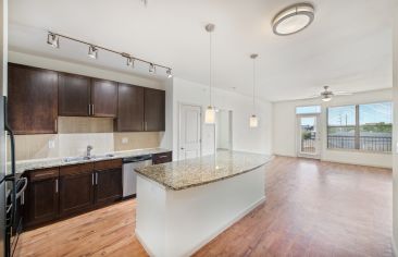 Kitchen and living room at MAA Midtown Square in Houston, TX