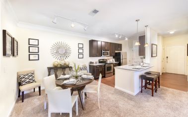 Kitchen and dining area at Seasons at Celebrate Virginia luxury apartment homes in Fredericksburg, VA