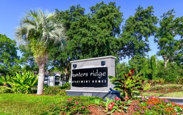 Sign at Hunters Ridge at Deerwood luxury apartment homes in Jacksonville, FL