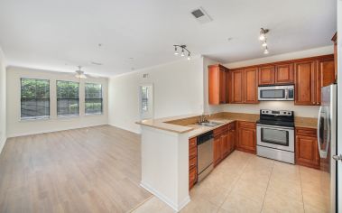 Model Kitchen and Living Room at Tattersall at Tapestry Park in Jacksonville, FL