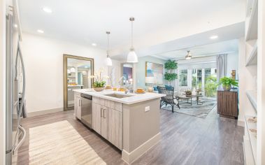 Kitchen and living area at MAA Robinson luxury apartments in Orlando, Florida