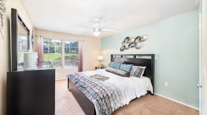 Bedroom at MAA Tiffany Oaks luxury apartment homes in Orlando , FL