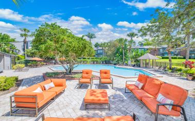 Pool deck at MAA Tiffany Oaks luxury apartment homes in Orlando , FL
