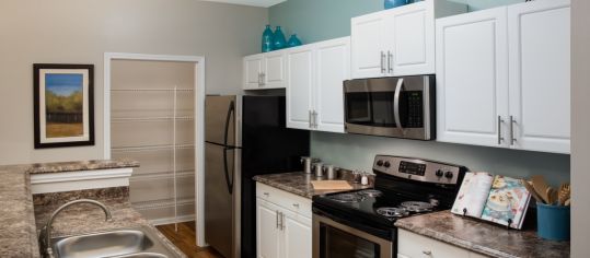 Kitchen & Living Room at MAA Barrett Creek luxury apartment homes in Atlanta, GA