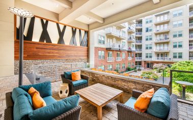 Fire pit lounge area at MAA Centennial Park luxury apartment homes in Atlanta, GA