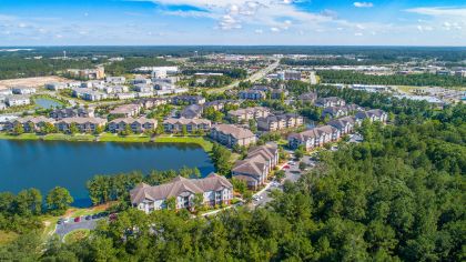 Lake drone view at Colonial Grand at Godley Lake luxury apartment homes in Savannah, GA