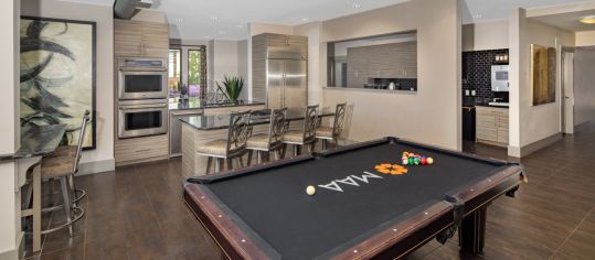 Game room & Kitchen at MAA 1225 luxury apartment homes in Charlotte, NC