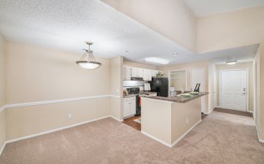 Dining room and kitchen at MAA Chancellor Park luxury apartment homes in Charlotte, NC