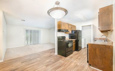 Kitchen and living area at MAA Spring Creek luxury apartment homes in Greenville, SC