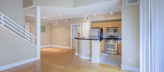 Kitchen and living room 2 at MAA Abbey luxury apartment homes in Dallas, TX