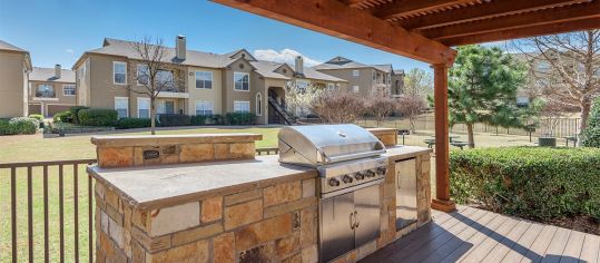 Outdoor grill area at MAA Boulder Ridge luxury apartment homes in Dallas, TX