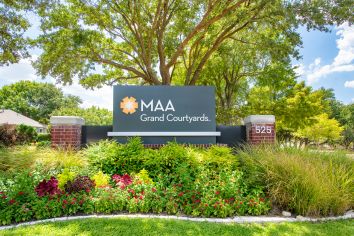 Signage at MAA Grand Courtyards luxury apartment homes in Grand Prairie, TX