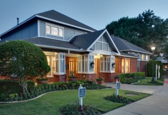 Exterior evening at MAA Grand Courtyards luxury apartment homes in Dallas, TX