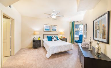 Spacious and cozy bedroom with a reading nook and modern furniture at MAA Heights luxury apartments in Dallas, TX