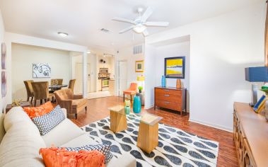 Modern-style rustic living room with hardwood floors in an open floorplan at MAA Heights luxury apartments in Dallas, TX