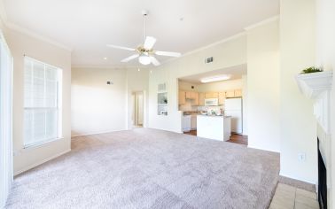 Living room and kitchen at MAA Shoal Creek  luxury apartment homes in Dallas, TX