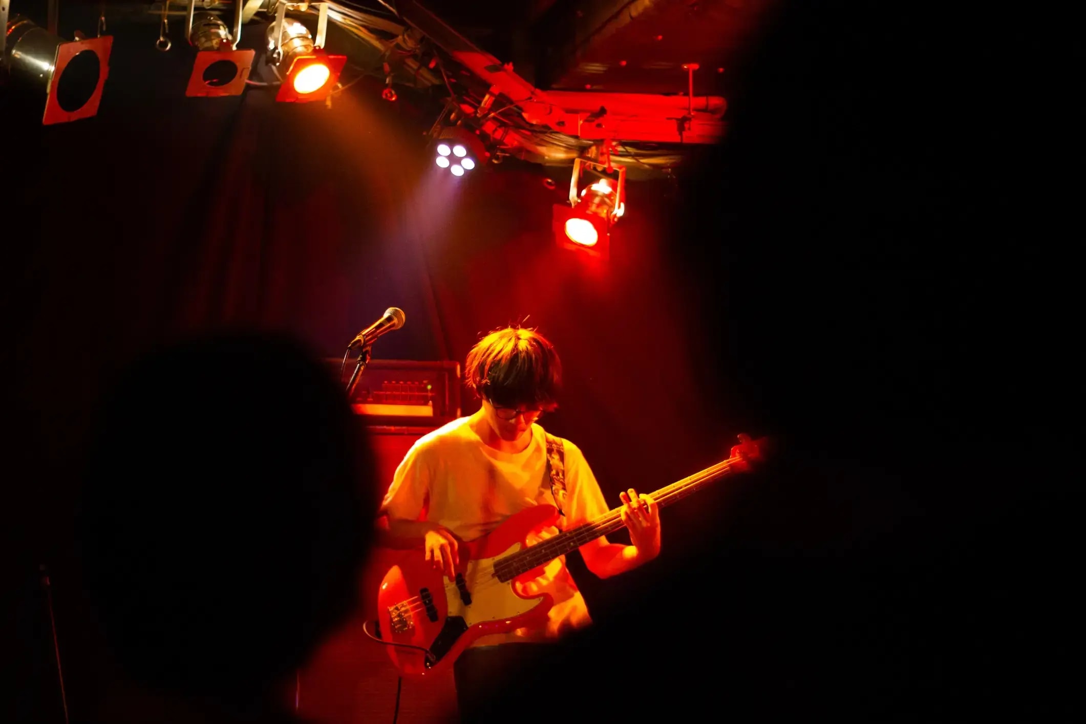 A man playing guitar on a stage