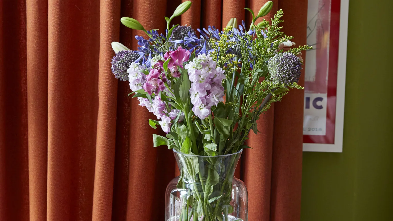 orange curtains with fresh flowers