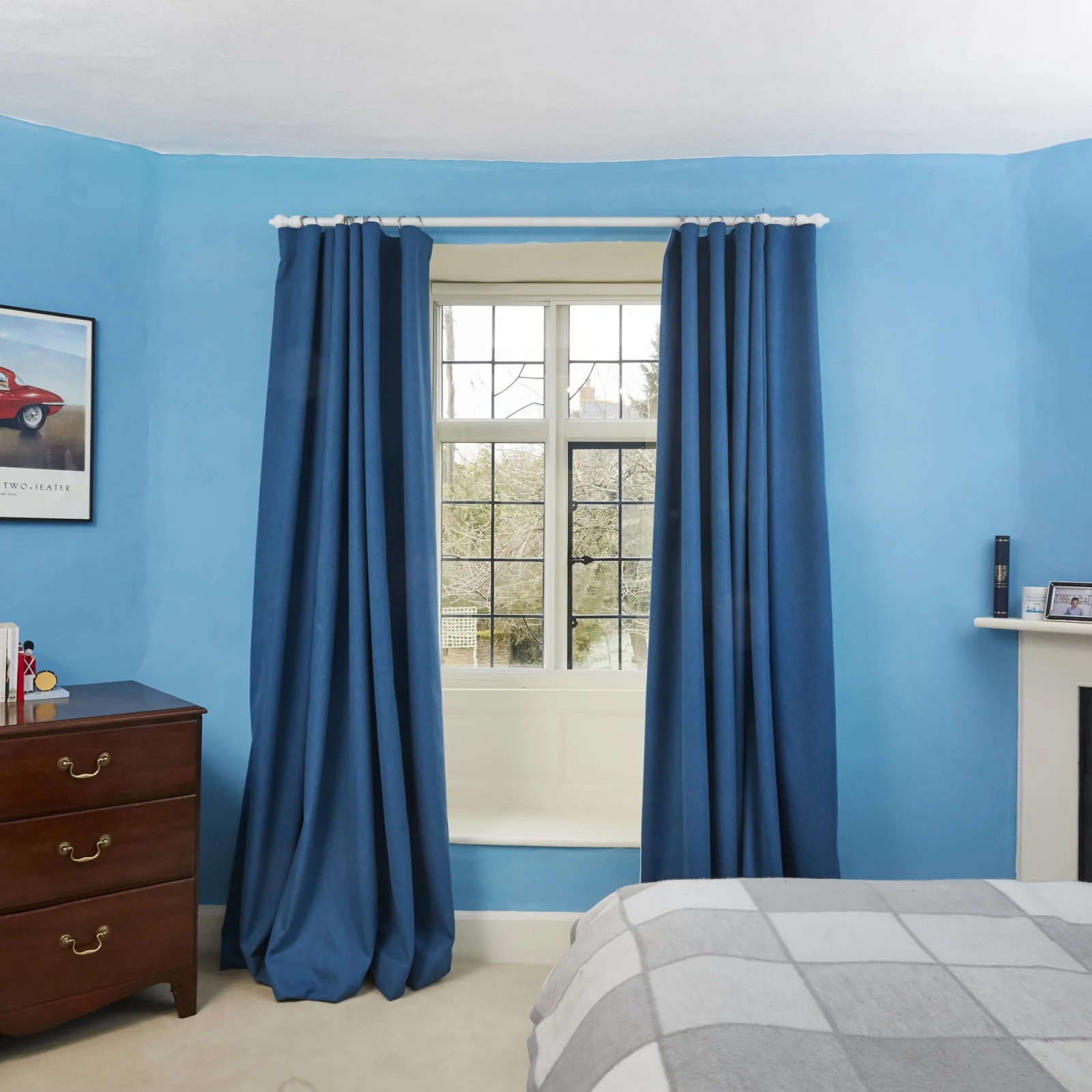 full table of breakfast food with blue curtains in the background