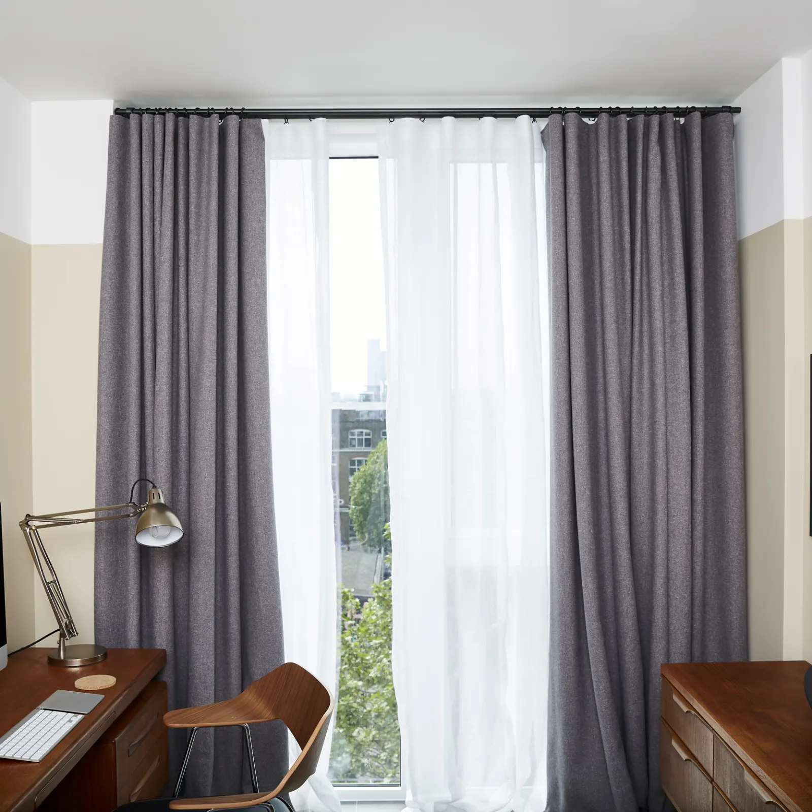 Grey and white curtains in a study room