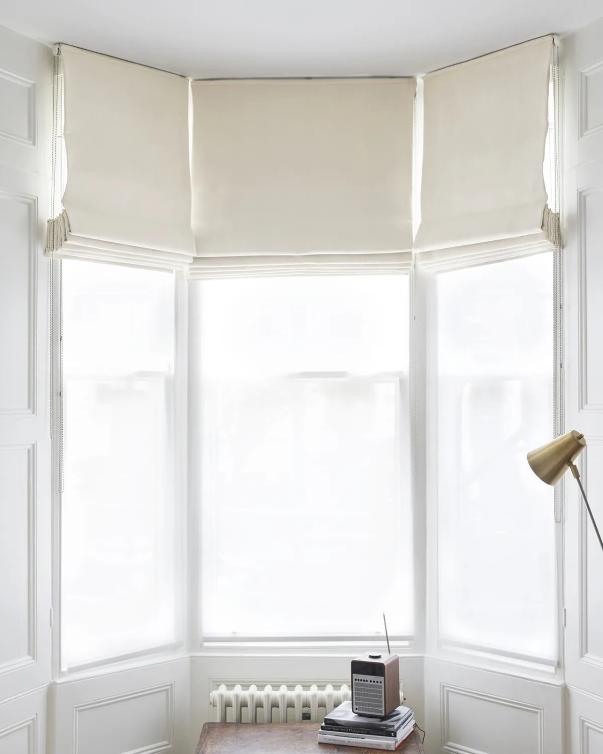 white bay window roman blinds