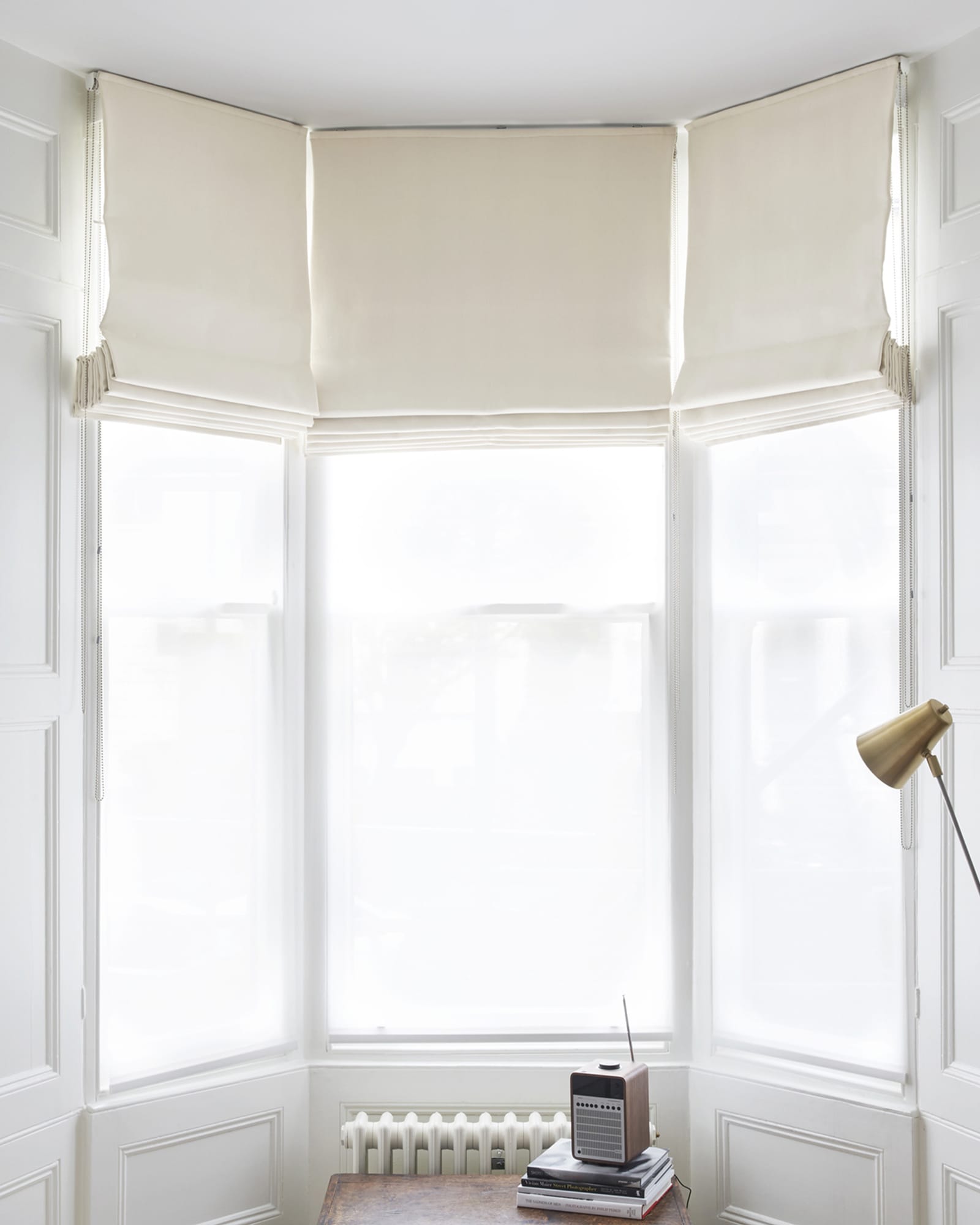 white cotton roman blinds