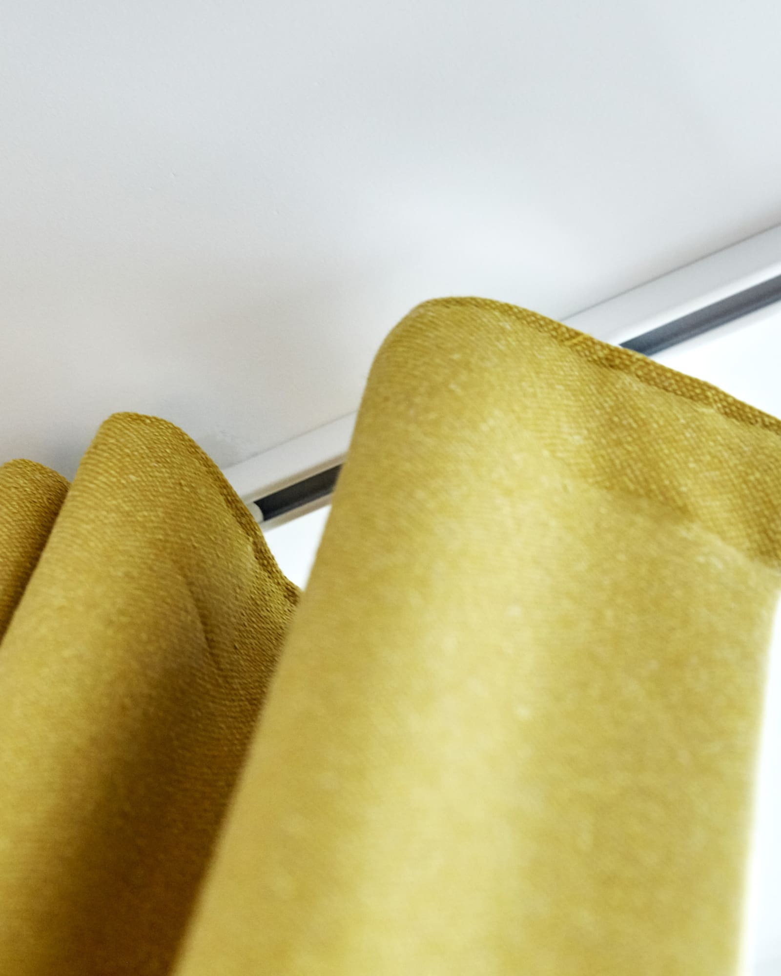 yellow curtains on a track