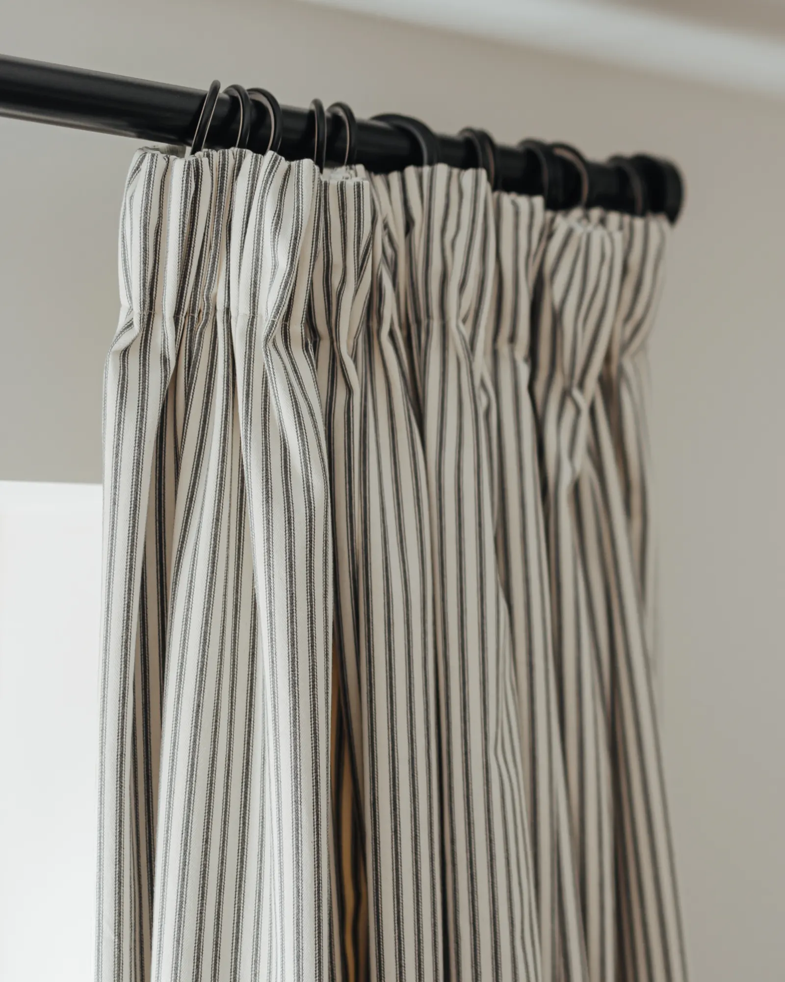 striped curtains on a pole