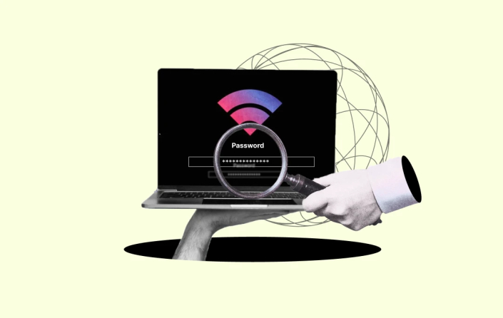 laptop screen showing password and a hand with magnifying glass