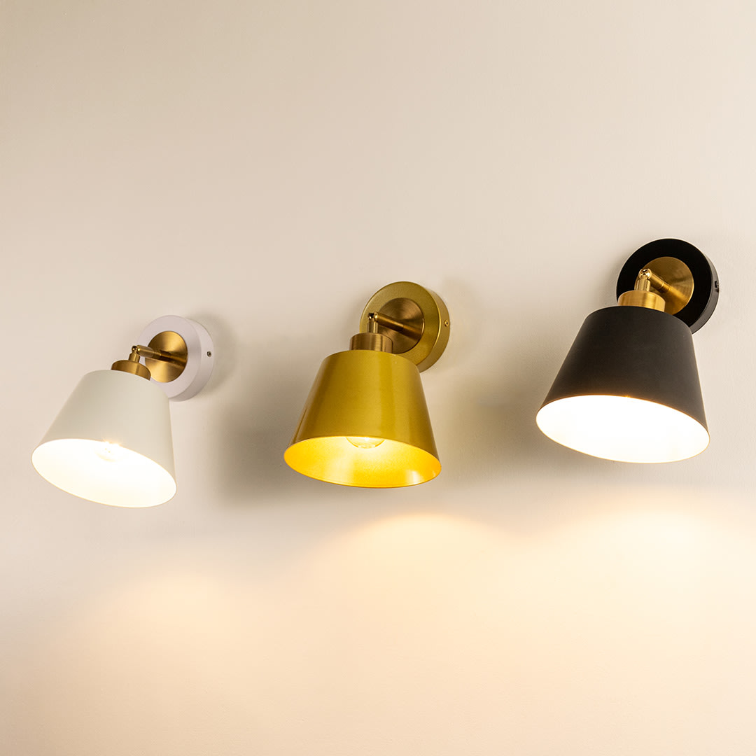 Modern wall sconces in white, gold, and black finishes